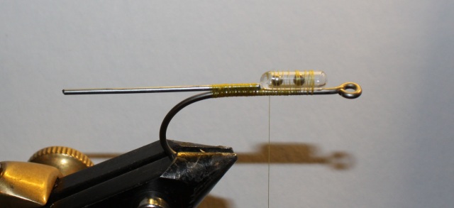First, take an 4/0 hook and tie in an stinger and an rassel tube!  the stinger is onley for the tail so it dont warp around the hook when you cast  the popper!!